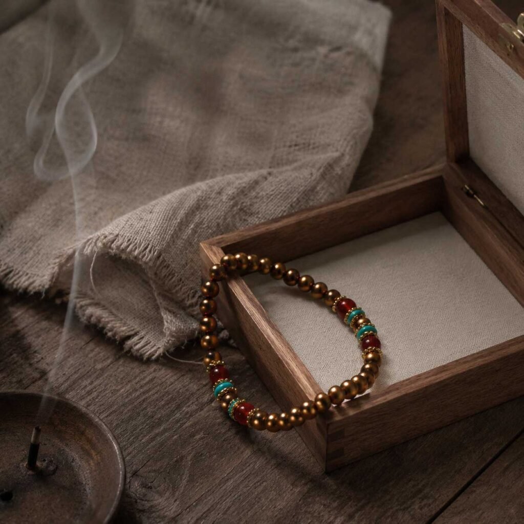 Close-up of a curated minimalist copper bracelet with clean, elegant lines, resting peacefully inside a simple natural wooden box under gentle mountain light.