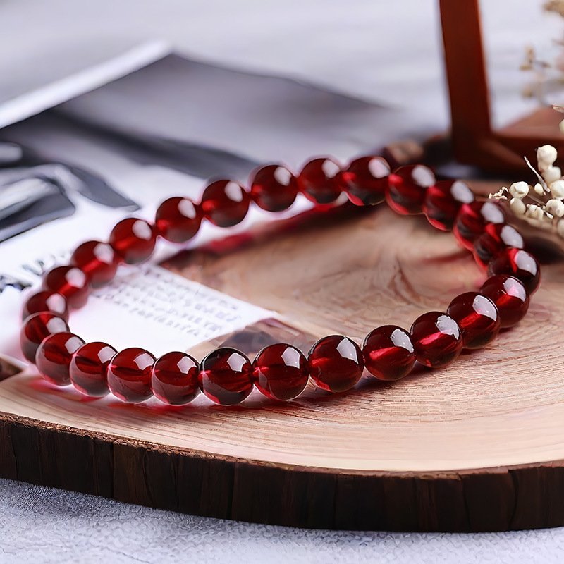 “The Wealth Alchemist” – Natural Red Garnet Prosperity Bracelet | Symbol of Confidence & Intention 5 Close-up of translucent red garnet beads showing deep luster and spiritual protection qualities