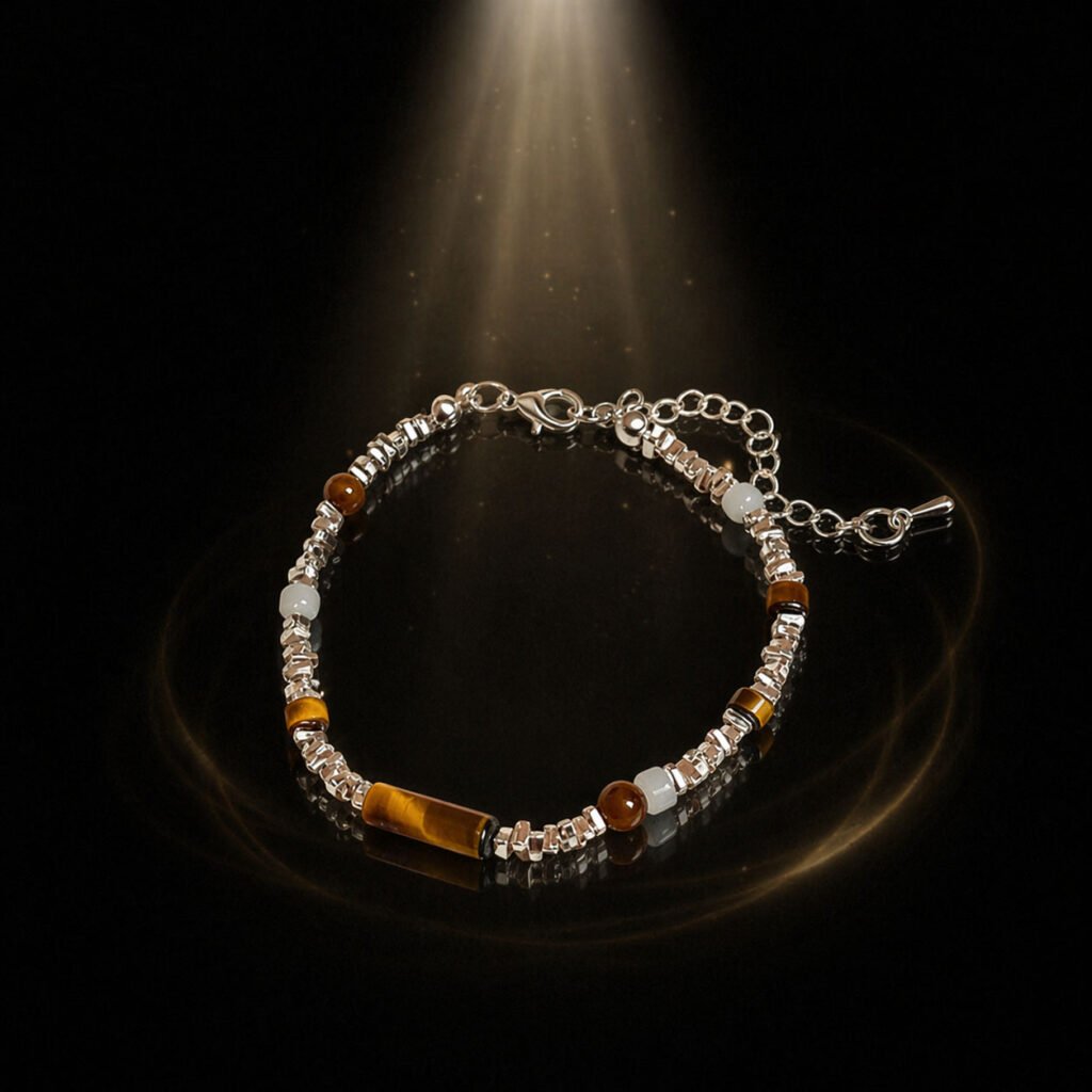 Artisan Tiger's Eye bracelet for 2026 protection, shown on a white ritual pedestal with silver accents.